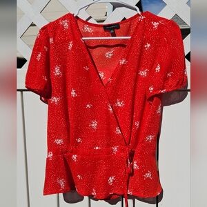 Tamara H. Vibrant wrap top